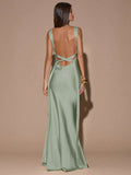 Back view of pale pink sleeveless deep V-neck maxi dress with crossed open back, shown for wedding and evening wear