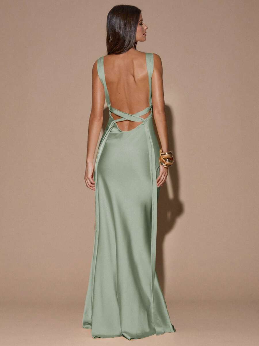 Back view of pale pink sleeveless deep V-neck maxi dress with crossed open back, shown for wedding and evening wear