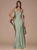 Front view of pale pink sleeveless deep V-neck maxi dress with crossed open back, shown for wedding and evening wear