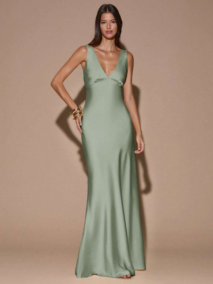 Front view of pale pink sleeveless deep V-neck maxi dress with crossed open back, shown for wedding and evening wear