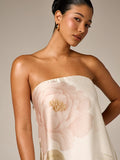 Close view of ivory satin bodice with large pale rose embroidery
