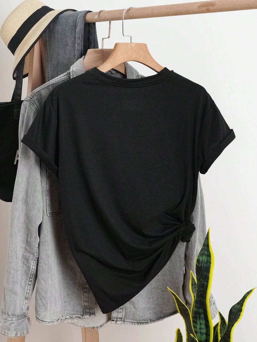Back view of black short-sleeve T-shirt on hanger with side knot and clothing-rack styling