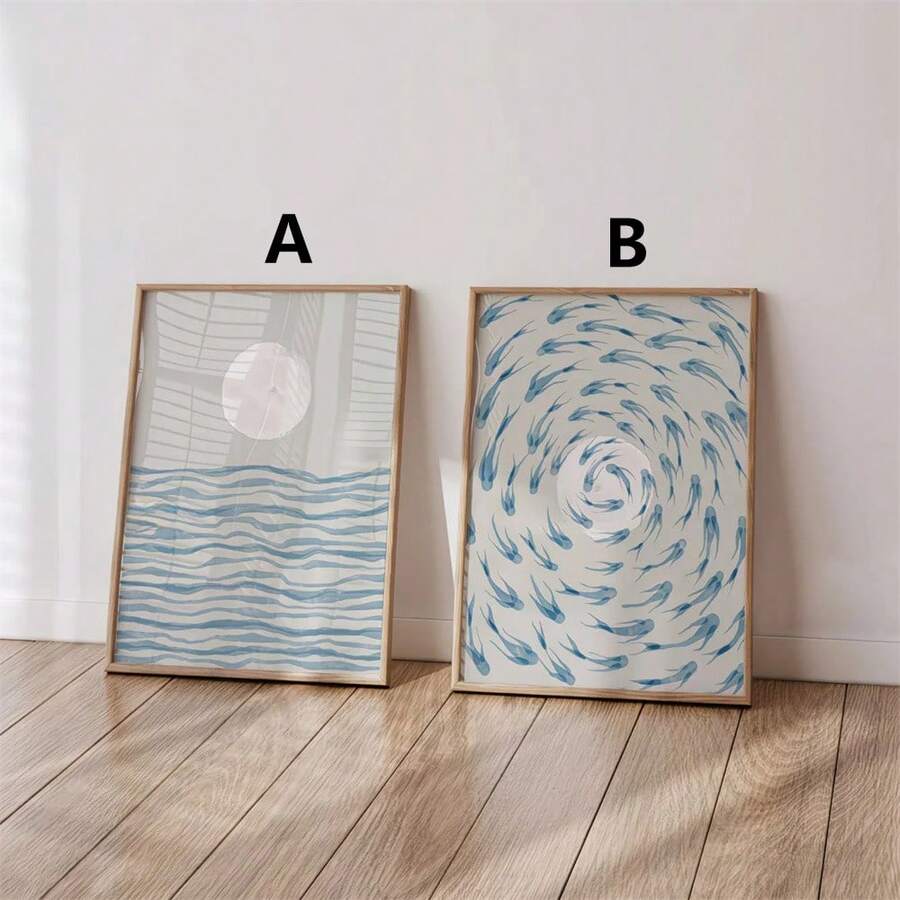 Reading nook view of moon-and-waves and circling-fish coastal wall art in wood frames