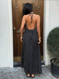 Capture effortless elegance with this blue plaid halter maxi dress, designed to blend classic charm with modern sophistication.