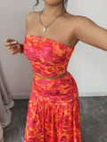 Styled view of floral strapless crop top and maxi skirt set showing visible color, print, and silhouette