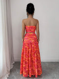 Styled view of floral strapless crop top and maxi skirt set showing visible color, print, and silhouette