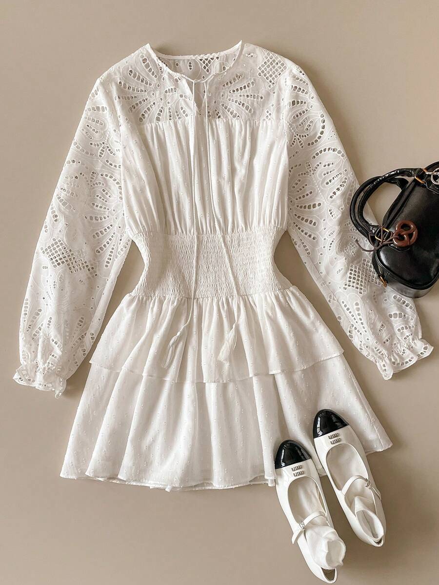 Embrace the essence of seasonal grace with this elegant Spring-Summer dress, a masterpiece of delicate craftsmanship designed for the modern romantic. Featuring intricate hollow embroidery that offers a hint of ethereal charm and a sophisticated bow tie neckline, this dress creates a refined and feminine silhouette perfect for garden weddings, afternoon tea, or upscale brunch dates. The cascading ruffle design adds a sense of playful movement and texture, while the lightweight, breathable fabric ensures you