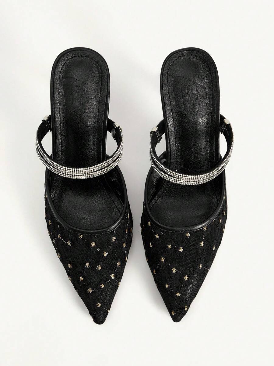 Elevate your look with these stunning mesh high heels featuring a sleek closed-toe design and single ankle strap. The delicate geometric hollow-out detailing adds an edgy sophistication, while the stiletto heel delivers timeless elegance. Versatile enough for weddings, parties, office settings, or night-out glamour, these black pumps transition seamlessly from day to evening. The breathable mesh upper keeps your feet comfortable, making them perfect for any occasion—from casual outings to special celebratio