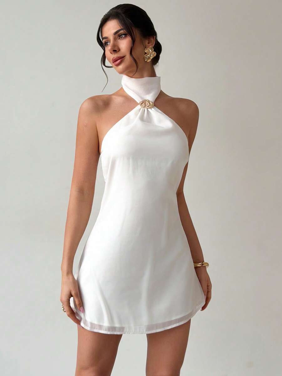 Effortless elegance meets summer style with this backless camisole dress. The minimalist silhouette features delicate straps and an open back design that catches the breeze, making it ideal for warm-weather adventures. Whether you're heading to the beach, a music festival, or a casual evening out, this versatile piece transitions seamlessly from day to night. Lightweight and comfortable, it's the perfect addition to your seasonal wardrobe.