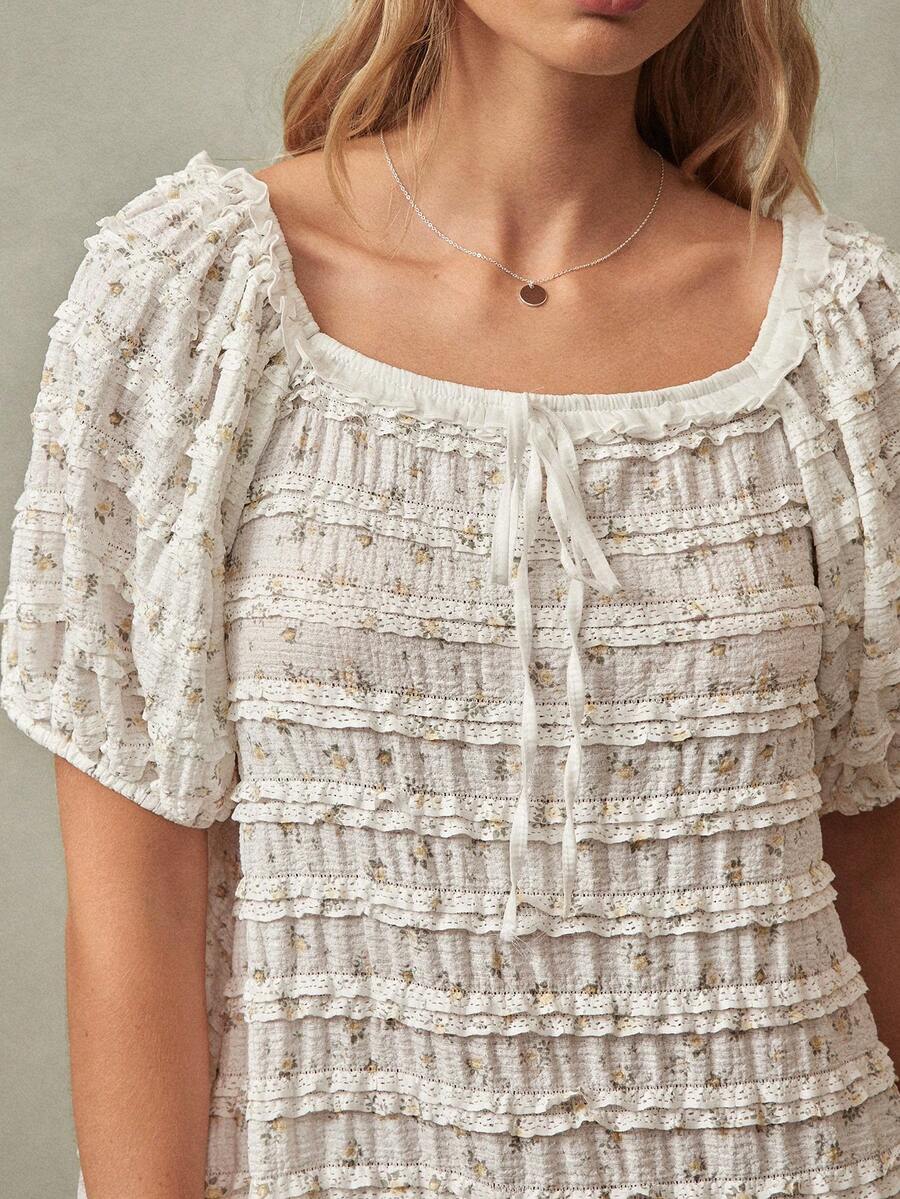 Exude effortless charm with this floral print square neck babydoll mini dress, a quintessential piece for the vibrant energy of Spring and Summer 2026 festivals. Designed with a classic square neckline and a breezy babydoll silhouette, this dress offers a playful yet sophisticated aesthetic that flatters every figure. The delicate floral motif and airy, high-quality fabric ensure you stay cool and comfortable during sun-drenched outdoor concerts, garden parties, or coastal getaways. Featuring romantic puffe