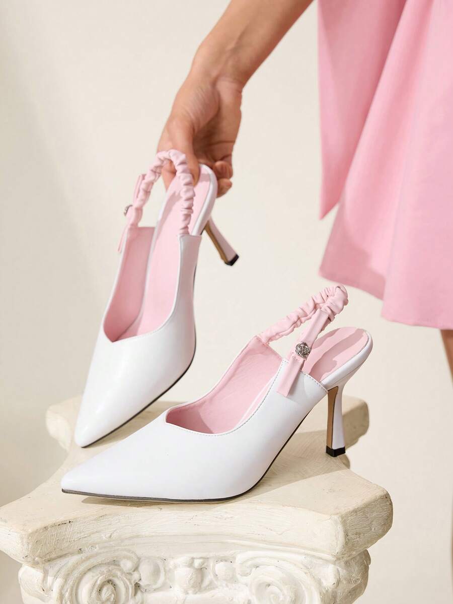 Step into sophistication with these elegant pink and white pointed stiletto heels, designed for the modern professional. Featuring a charming bow and delicate frill details, these slingback beauties combine timeless style with contemporary flair. Crafted from premium PU leather, the high stiletto heel elongates your silhouette while the pointed toe adds a touch of refinement. Perfect for office settings, spring outings, or special occasions, these versatile heels transition seamlessly from work to weekend. 