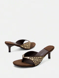 Front product view of brown suede-look kitten heel sandals showing mixed-size rivet decoration