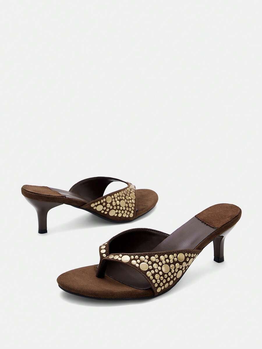 Front product view of brown suede-look kitten heel sandals showing mixed-size rivet decoration