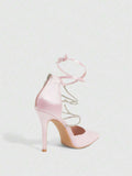 9 media show white black and pink satin pointed toe stiletto pumps with rhinestone crisscross instep cage straps, ankle wrap tie, side cutouts, tall back counter, back zipper. image 8