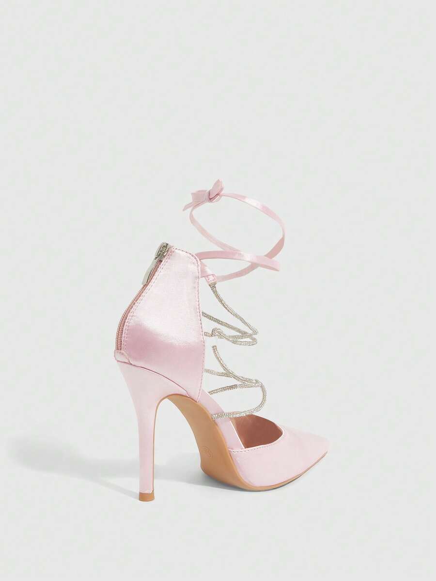 9 media show white black and pink satin pointed toe stiletto pumps with rhinestone crisscross instep cage straps, ankle wrap tie, side cutouts, tall back counter, back zipper. image 8
