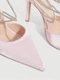 9 media show white black and pink satin pointed toe stiletto pumps with rhinestone crisscross instep cage straps, ankle wrap tie, side cutouts, tall back counter, back zipper. image 9
