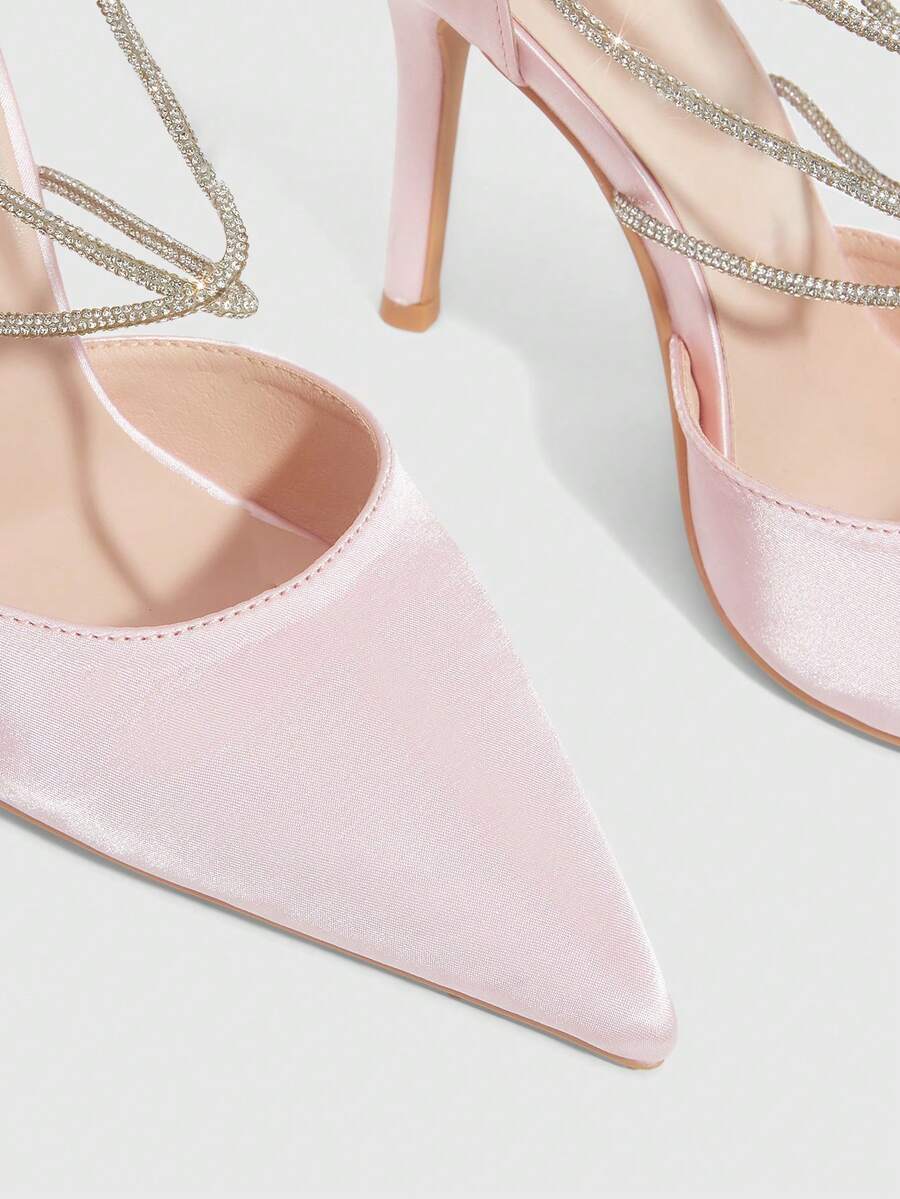9 media show white black and pink satin pointed toe stiletto pumps with rhinestone crisscross instep cage straps, ankle wrap tie, side cutouts, tall back counter, back zipper. image 9