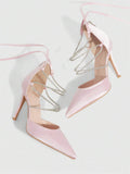 9 media show white black and pink satin pointed toe stiletto pumps with rhinestone crisscross instep cage straps, ankle wrap tie, side cutouts, tall back counter, back zipper. image 7