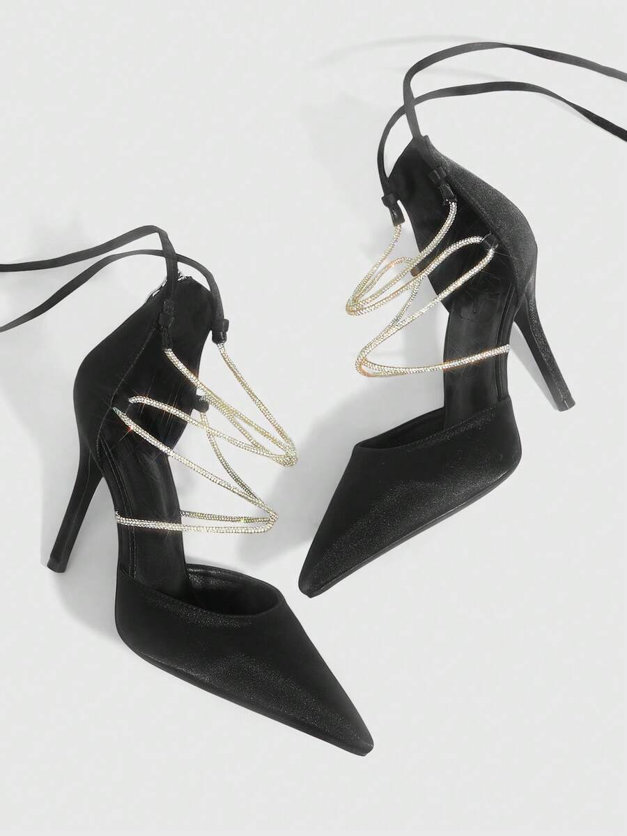 9 media show white black and pink satin pointed toe stiletto pumps with rhinestone crisscross instep cage straps, ankle wrap tie, side cutouts, tall back counter, back zipper. image 4