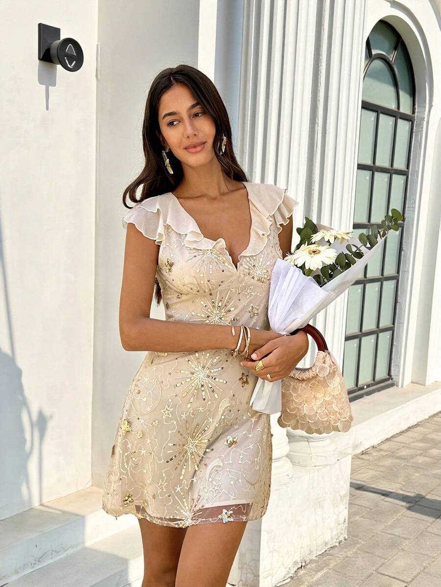 Full front party view of apricot embellished mini dress with deep V neck and A-line hem