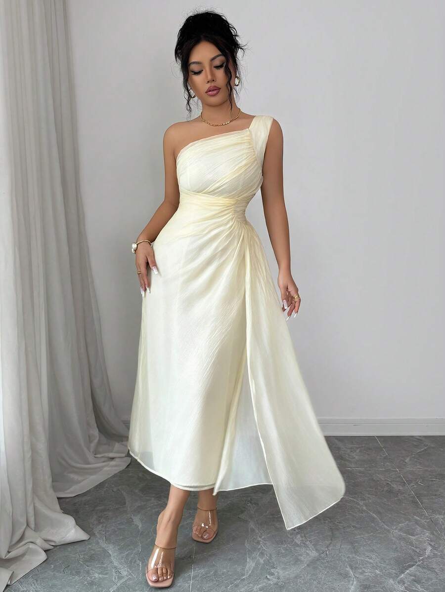 Elevate your everyday style with this sophisticated sleeveless midi dress. Crafted in a timeless solid color, it features delicate pleated details and charming ruffle accents that add movement and dimension. The midi length offers versatile wear—dress it up for brunch or pair it with sneakers for casual outings. Perfect for warm weather, this piece transitions seamlessly from day to night, making it an essential addition to any wardrobe.