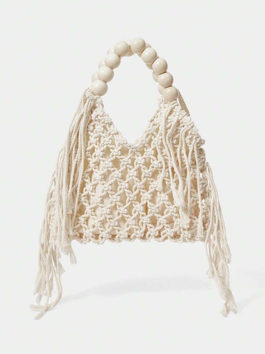 Ivory crochet hollow beach bag with round bead handle and side tassels