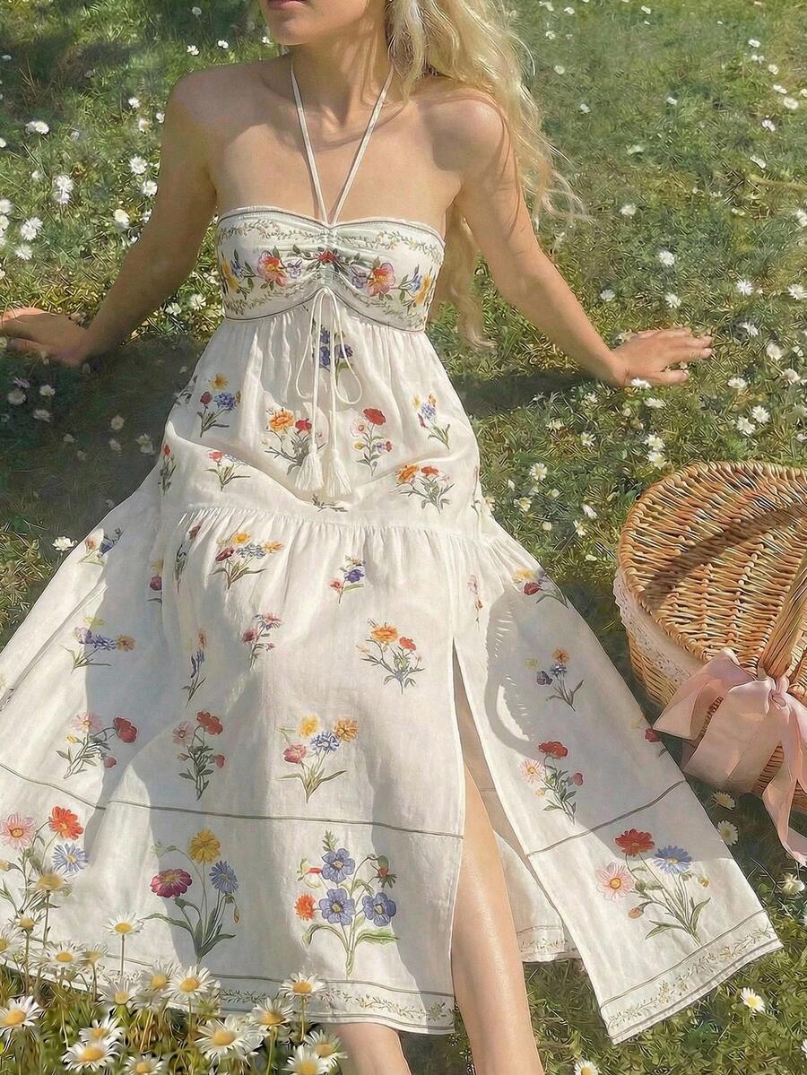 Exude Botanical Sophistication in Our Elegant Floral Print High Slit Halter Dress!

Experience the breathtaking fusion of vibrant floral heritage and sharp, modern artisanal tailoring. This stunning halter-neck maxi dress is meticulously designed for the woman who values a high-fashion, "quiet luxury" approach to seasonal celebrations—the ultimate centerpiece for prestigious garden weddings, exclusive vacation retreats, and high-authority summer social gatherings.

Iconic Floral Print Artistry: Featuring a 