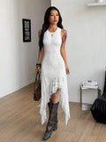 Front view of white sleeveless lace dress with fitted shape and long asymmetric skirt panels