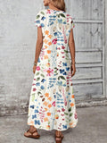 Back view of multicolor watercolor floral maxi dress with center seam