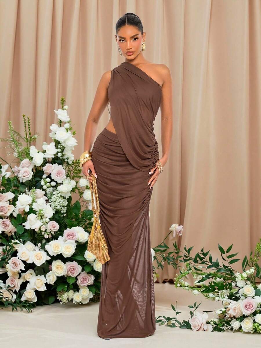 Front view of chocolate brown one shoulder mesh maxi dress with ruched waist and floor length hem