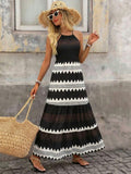 Front view of graphic color block halter maxi dress styled for a beach vacation