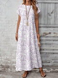 Outdoor view of tan boho maxi dress with round neck and loose fit