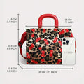 Size diagram of cherry and leopard-print handbag with red handles and phone for scale