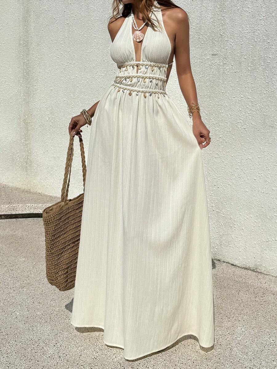 Front view of white boho halter maxi dress with layered shell waist trim