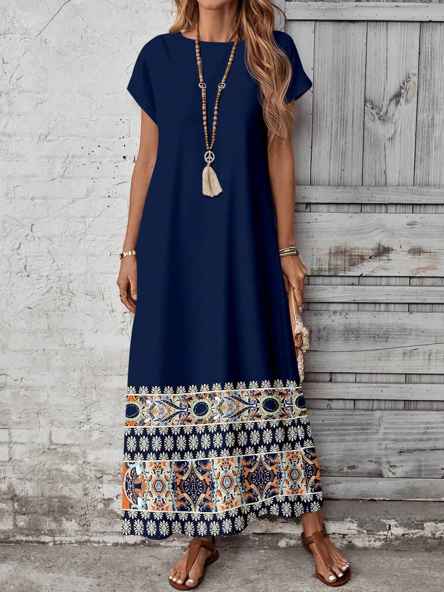 Front view of loose navy maxi dress with round neck and short sleeves