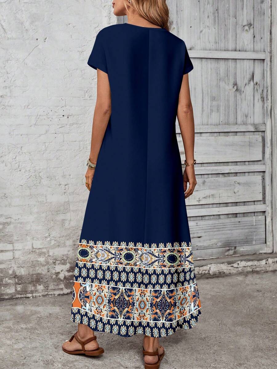 Front view of loose navy maxi dress with round neck and short sleeves