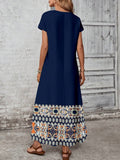 Back view of solid navy loose maxi dress with clean long silhouette