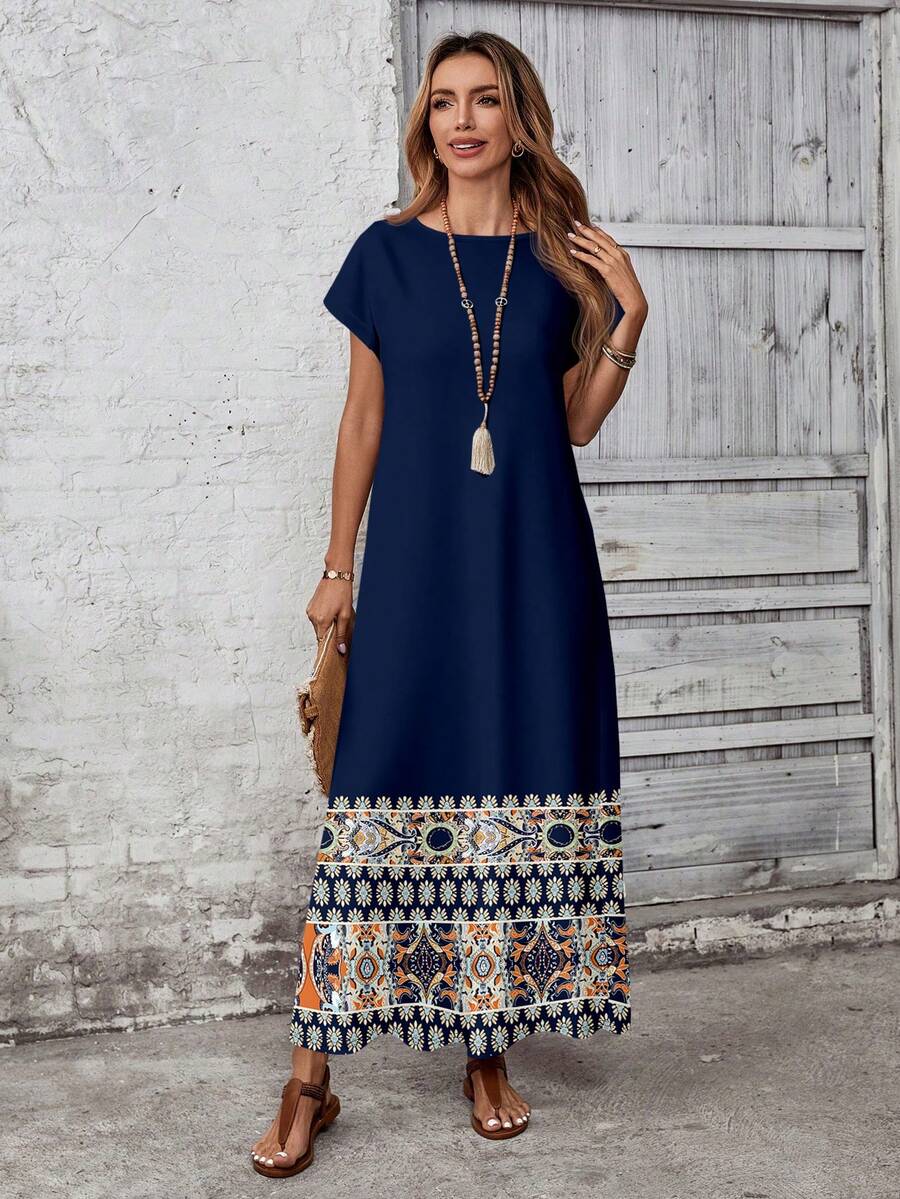 Navy maxi dress with border print hem and simple round neck