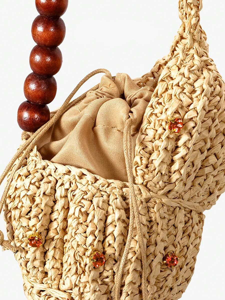 Close view of shell raffia bag showing crocheted texture and cord trim