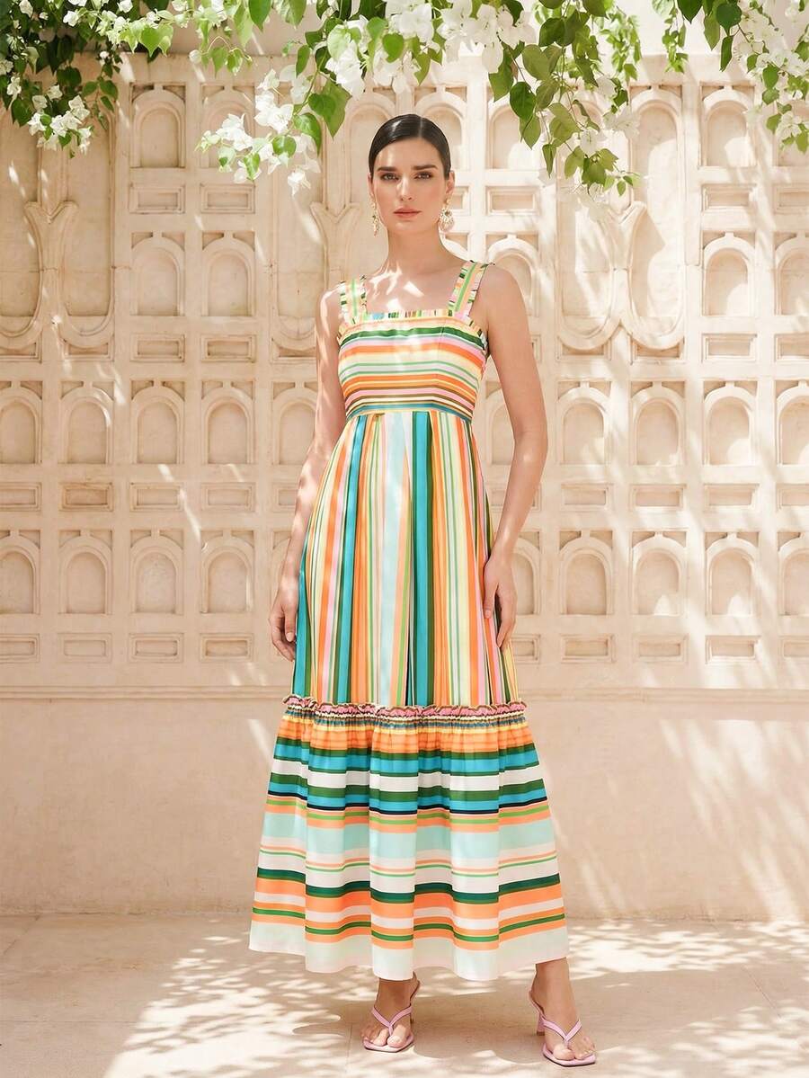 Experience the breathtaking fusion of botanical-inspired heritage and sharp, modern architectural tailoring. This stunning blue-green striped ensemble is meticulously designed for the woman who values a high-fashion, "quiet luxury" approach to seasonal dressing—the ultimate centerpiece for prestigious spring garden parties, exclusive summer retreats, and high-authority coastal soirées.