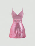 Back view of pink backless sequin dress with bow tie
