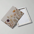 Front and back construction view of dried wildflower print wrapped on a wood stretcher