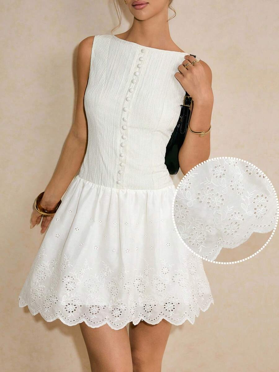 Embrace the crisp, refreshing spirit of the season with this chic white eyelet embroidered sleeveless mini dress, the quintessential sundress for your Summer 2026 wardrobe. Featuring intricate floral eyelet detailing that offers both delicate texture and enhanced breathability, this dress is meticulously crafted to keep you cool and stylish during sun-drenched afternoons. The sleeveless silhouette and flattering mini length create a youthful, airy aesthetic perfect for beachside brunches, tropical vacations