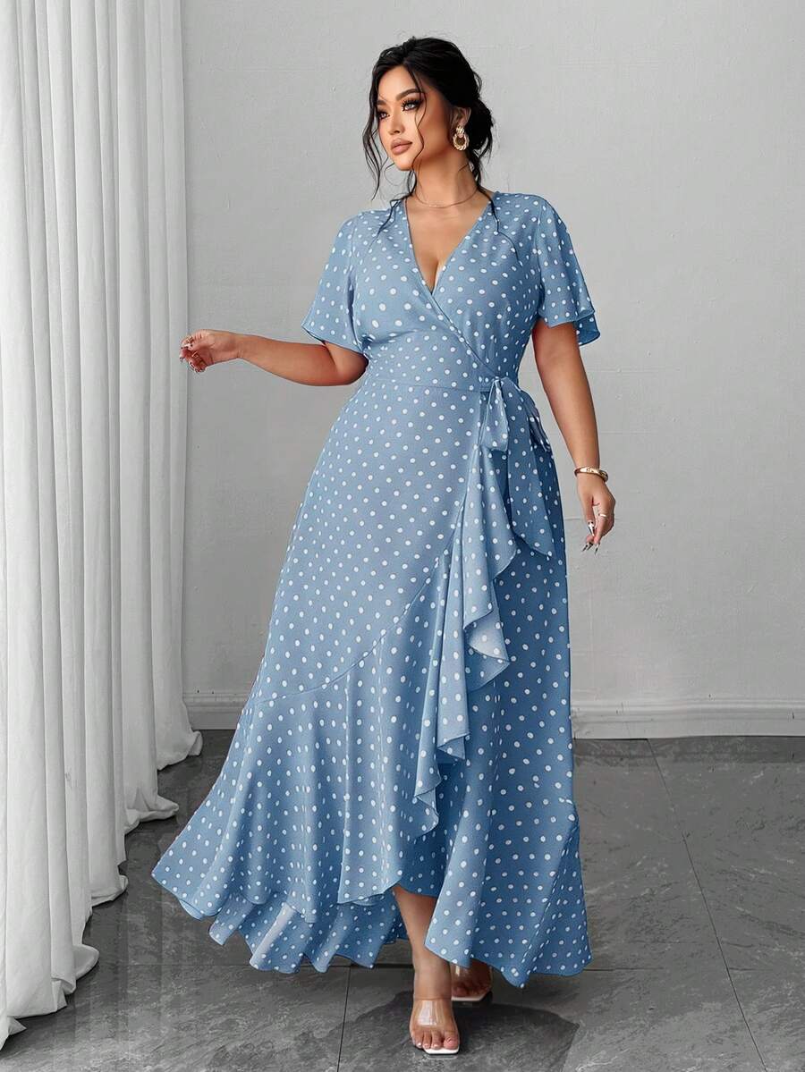 Embrace timeless style with this charming plus-size wrap dress, featuring a classic polka dot pattern that flatters every figure. The adjustable tie waist creates a custom fit while defining your silhouette, while the playful ruffle hem adds movement and dimension. Crafted for comfort and versatility, this dress transitions effortlessly from casual outings to special occasions. Perfect for those who appreciate feminine details without compromising on ease of wear.