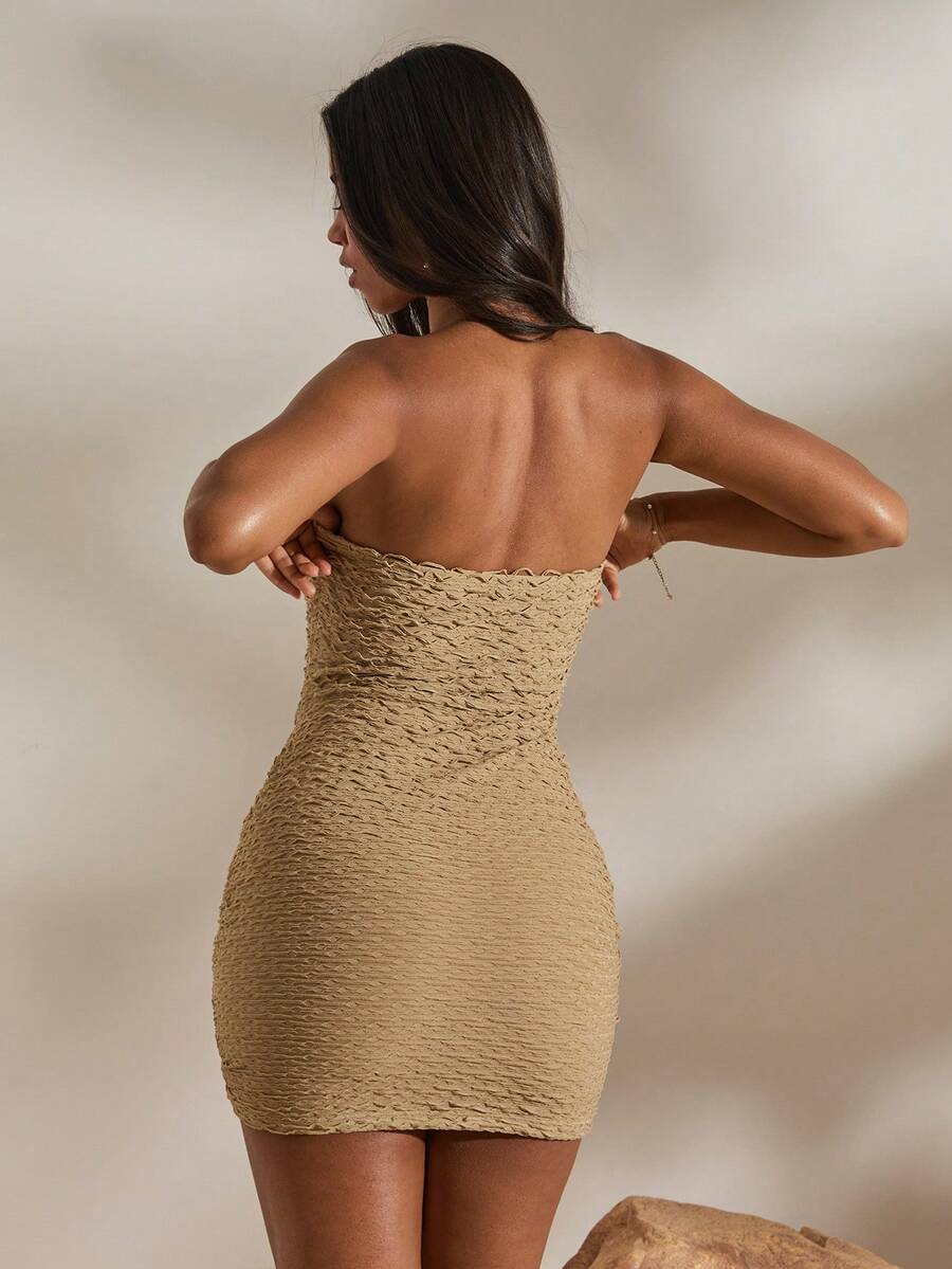 Textured beige bodycon mini dress detail with wavy neckline
