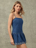 Front close-up of square-neck denim mini dress with gathered flared skirt