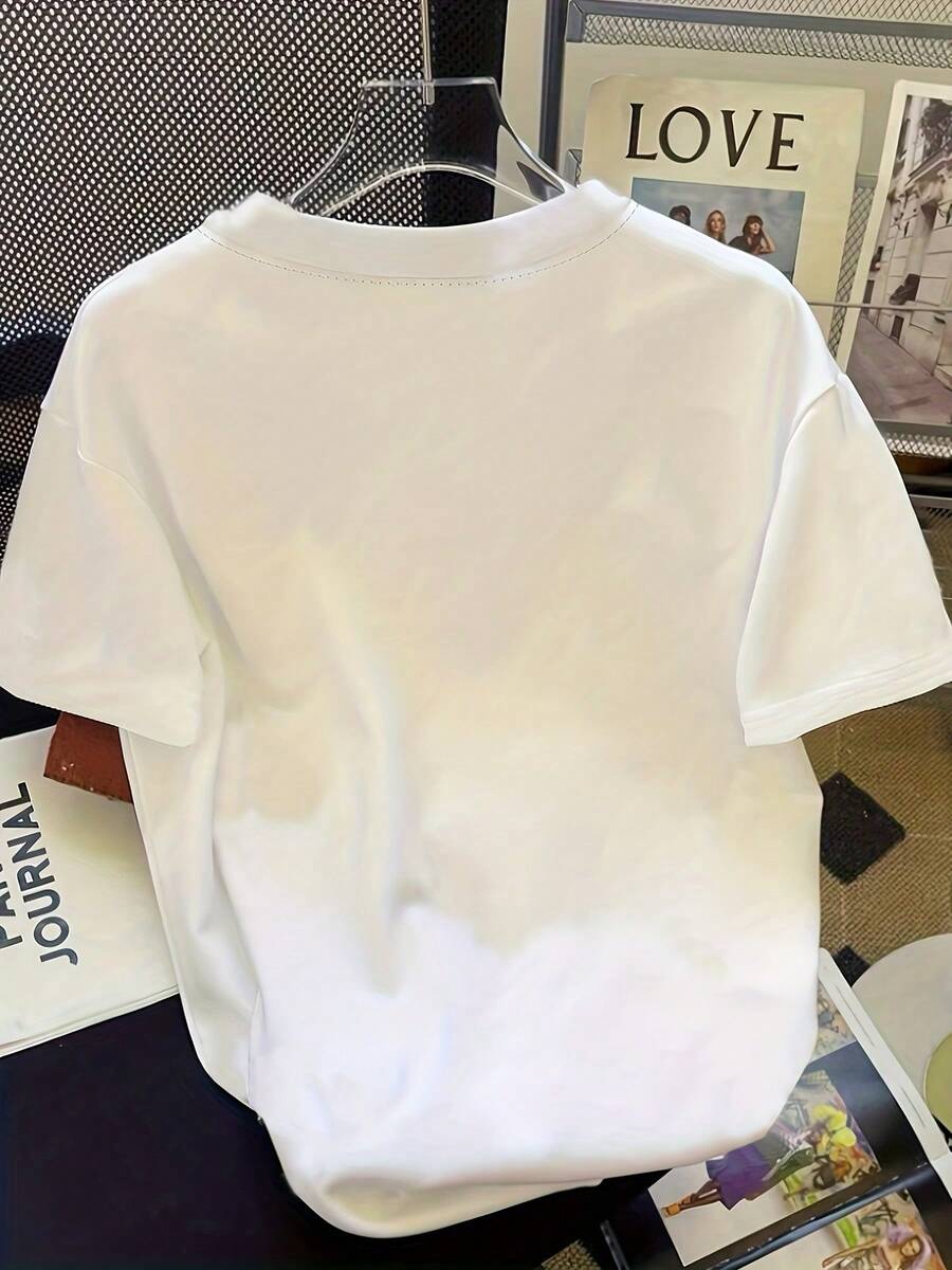 Step back in time with this charming vintage-inspired tee featuring a striking black and white floral print. The relaxed fit drapes beautifully for all-day comfort, while short sleeves keep you breezy during warmer months. Perfect for spring and summer adventures, this timeless piece pairs seamlessly with denim, linen pants, or casual skirts. The classic botanical design brings understated elegance to your everyday rotation. A wardrobe staple that never goes out of style.