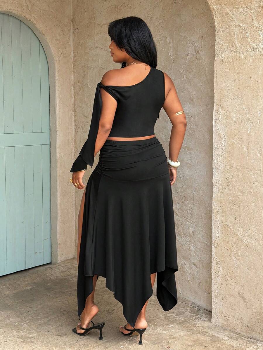 plus size two-piece skirt set in black olive green and brown with asymmetric one-shoulder crop top, draped shoulder tie panel, high waist ruched midi skirt, handkerchief hem and high thigh slit image 3