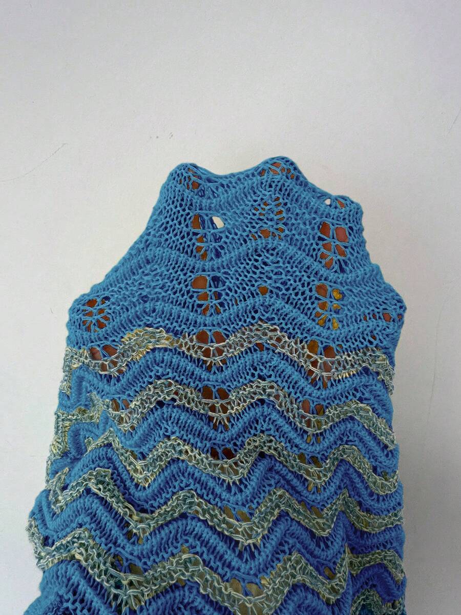 Front view of blue crochet bodycon maxi dress with silver chevron openwork stripes and flared hem