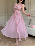 Light pink halter dress in motion with ruffled trim and flared skirt